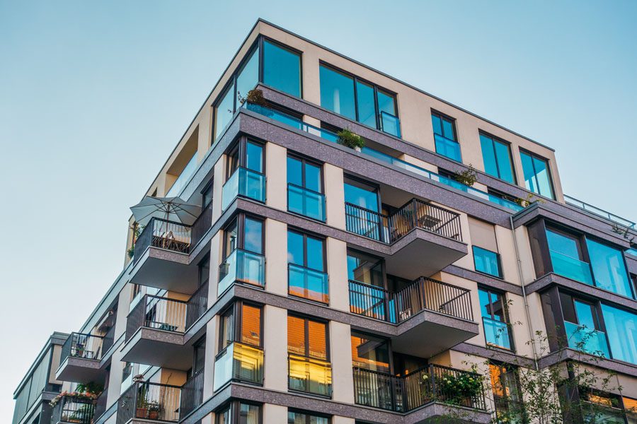 Condo Building Insurance - Condo Building with Balconies and Blue Skies